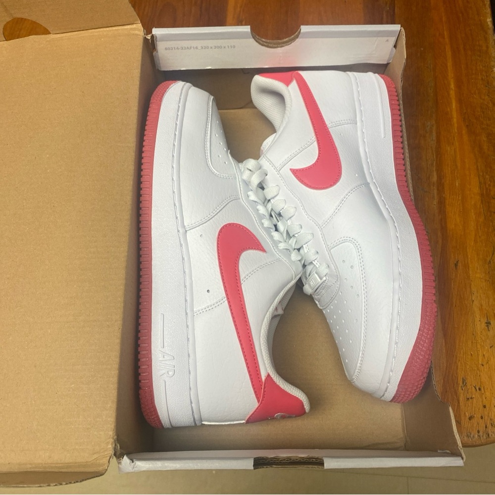 Nike White Low-Top Sneakers with Pink Swoosh and Pink Outsole